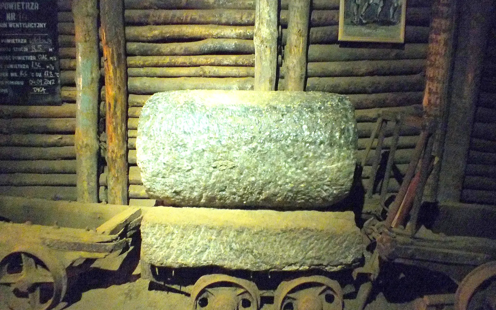 A wooden salt cart with a block of rock salt in the Bochnia mine