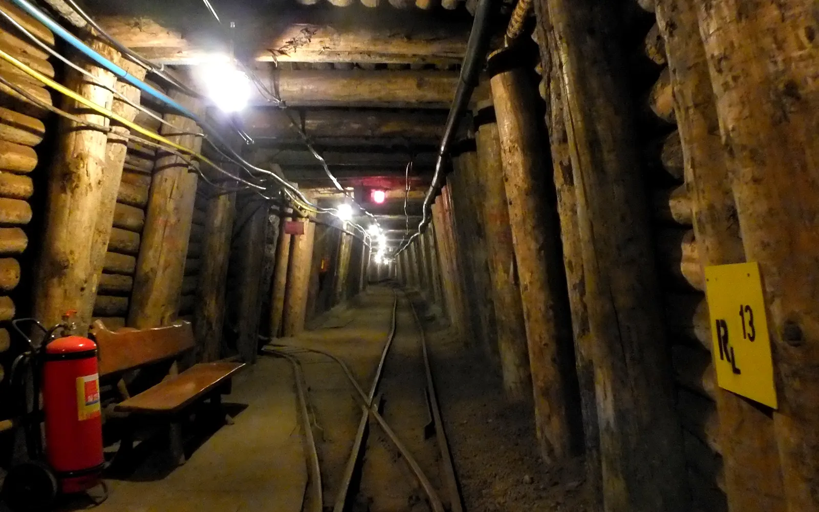 A timbered gallery lit by lamps inside the Bochnia Salt Mine